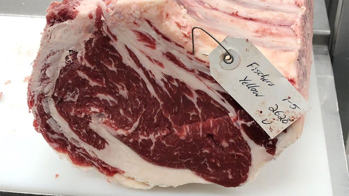 A close up of marbling on a cut of beef