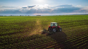 tractor cultivating field